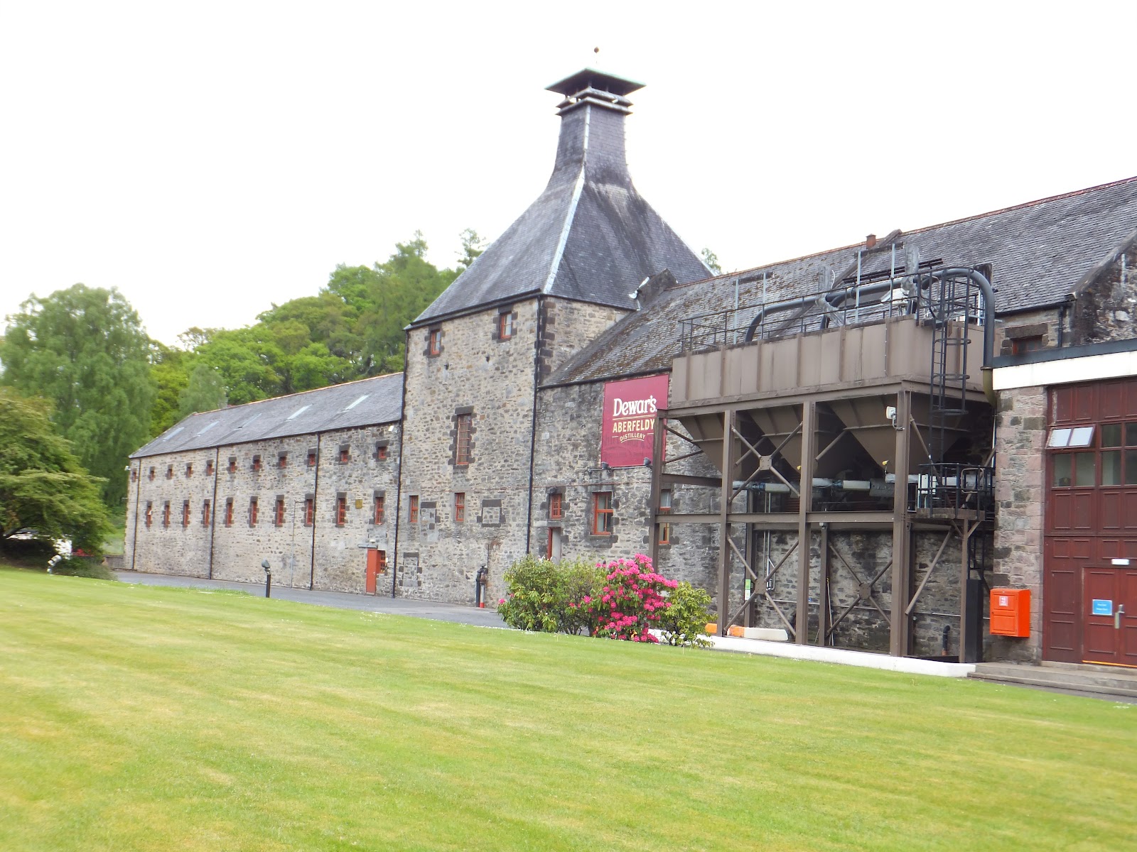 The pagoda-roofed Aberfeldy distillery across its lawn.