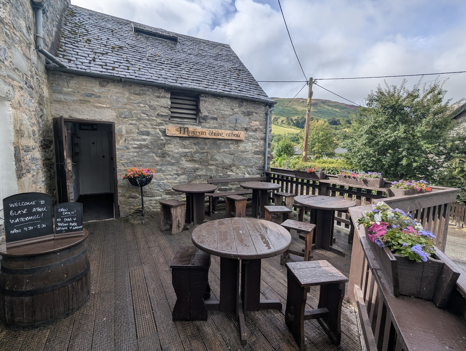 Tables on the terrace outside Blair Atholl Watermill.