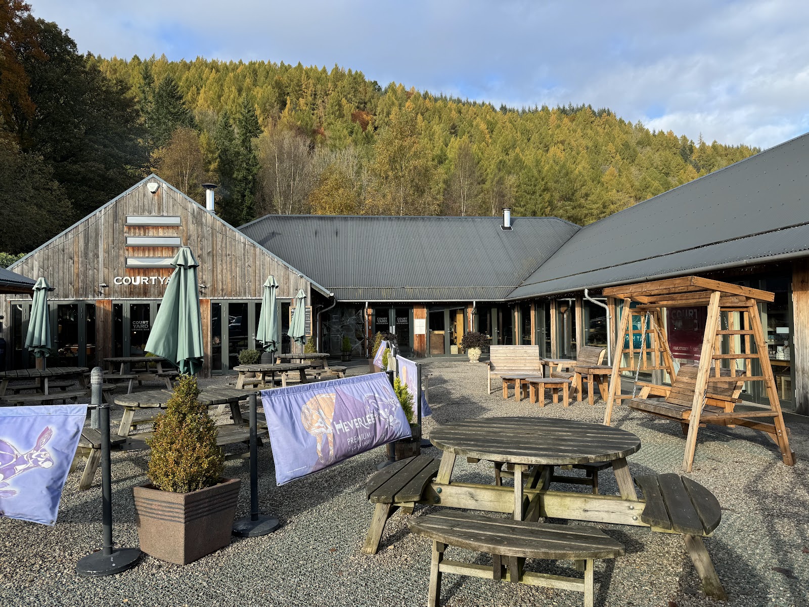The Courtyard and its terrace among the trees at Mains of Taymouth.