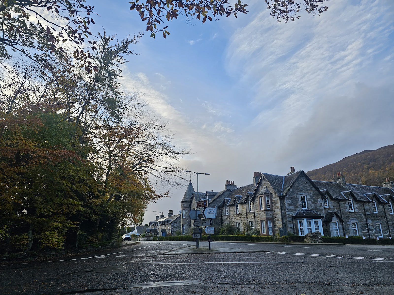 Kinloch Rannoch under the hills on an autumn morning, the old hotel along the road.
