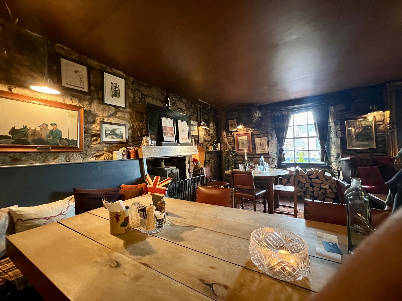 Tables under old beams in the bar of the Kirkstyle Inn.