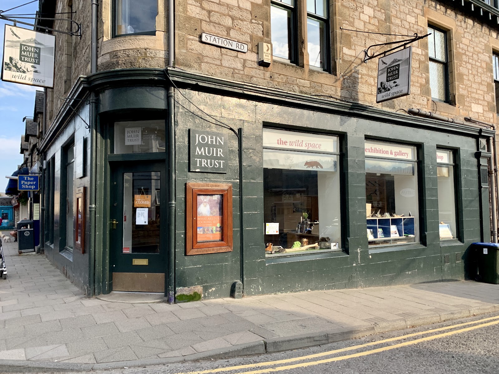 The John Muir Trust's green corner shopfront on Atholl Road, Pitlochry.