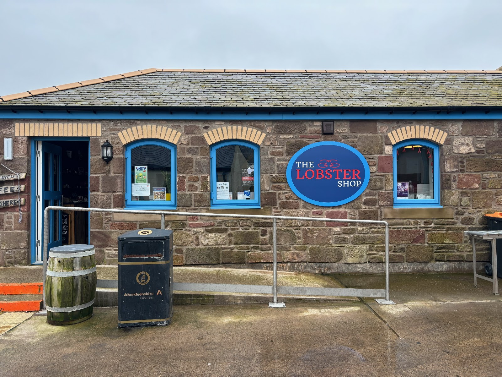 The Lobster Shop on Fore Street, Johnshaven, its blue windows under a lobster sign.
