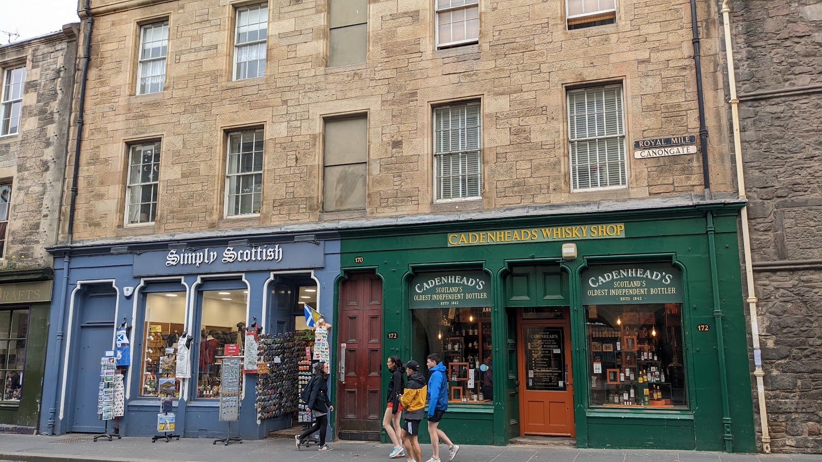 The green front of Cadenhead's on the Canongate.