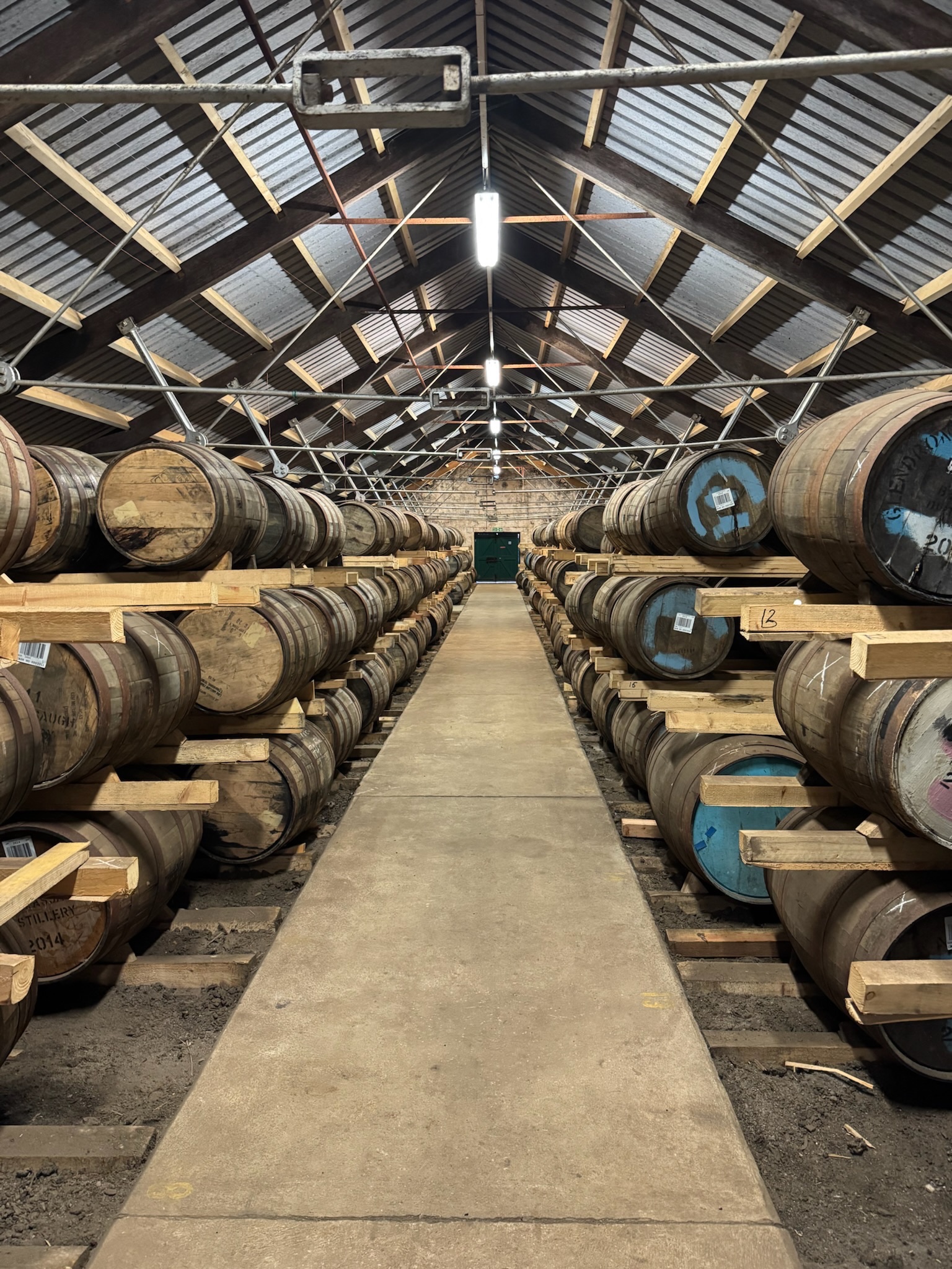 Rows of casks on their racks in a Glenglassaugh warehouse.