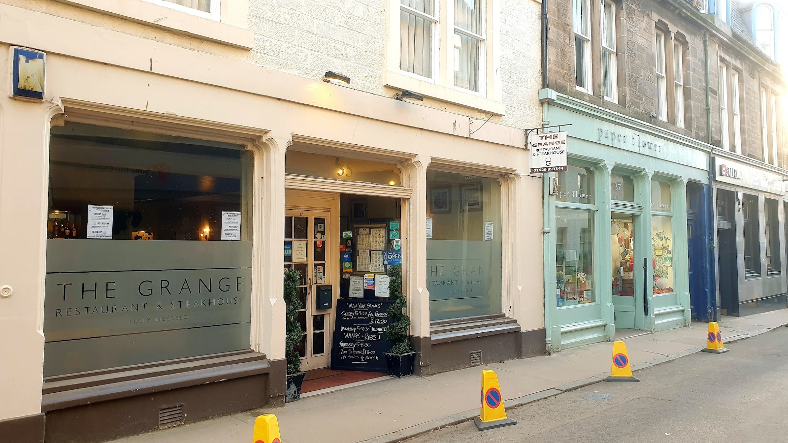 The Grange on North Berwick High Street, a pale shopfront with its name on the window.