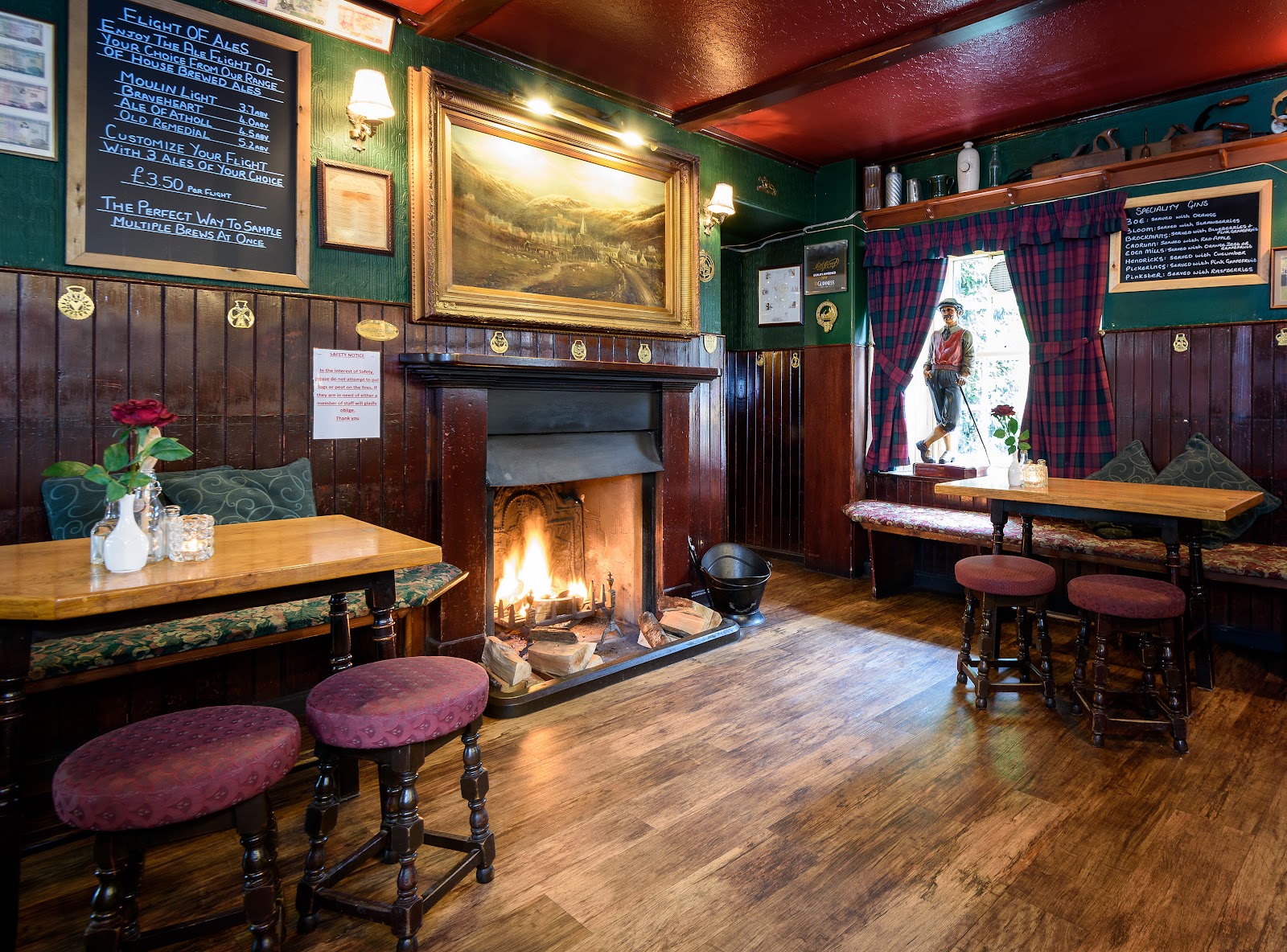 The bar at the Moulin Inn, tables by an open fire under old beams.