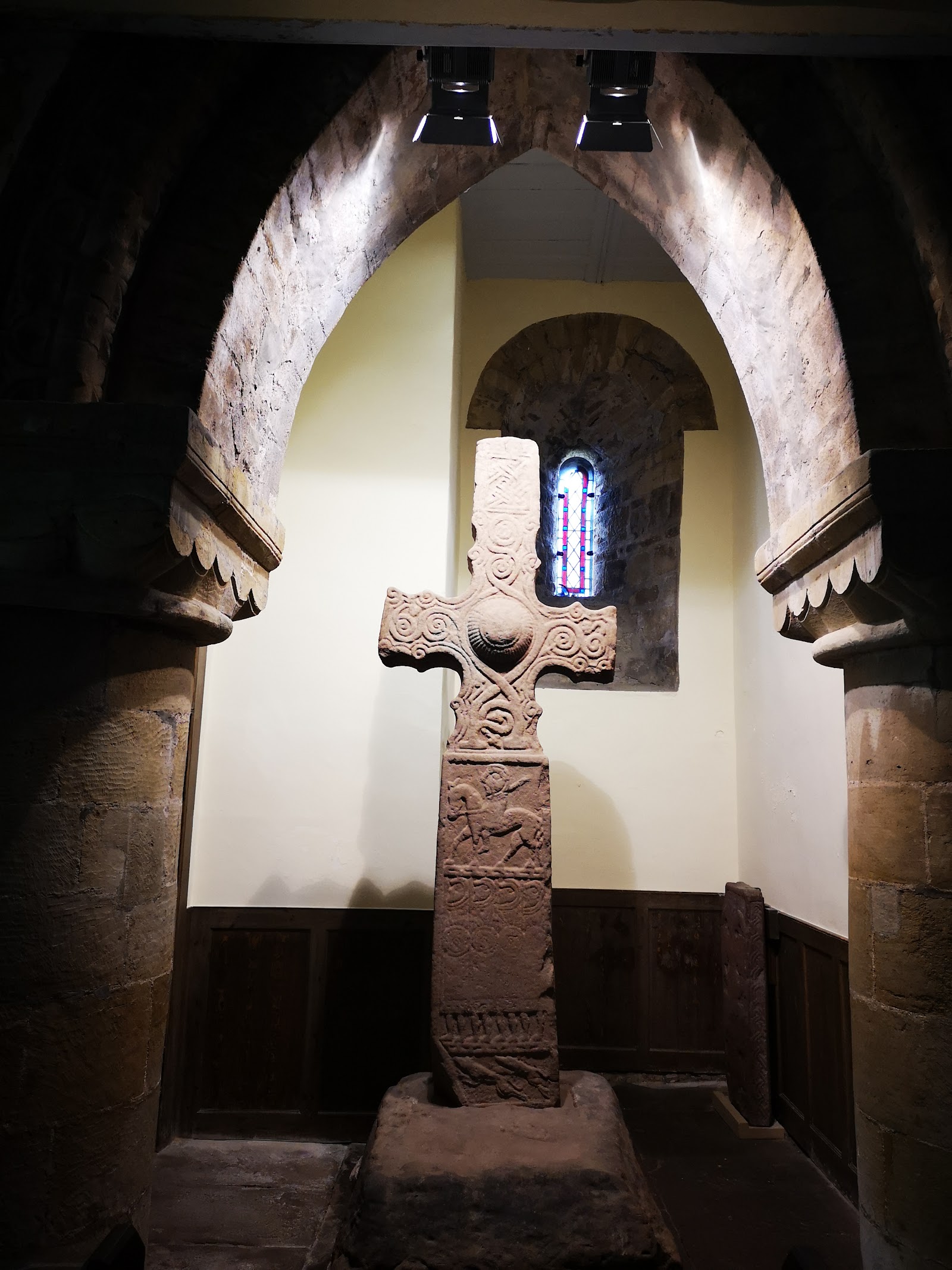 An old carved stone cross inside St Serf's Church, Dunning.