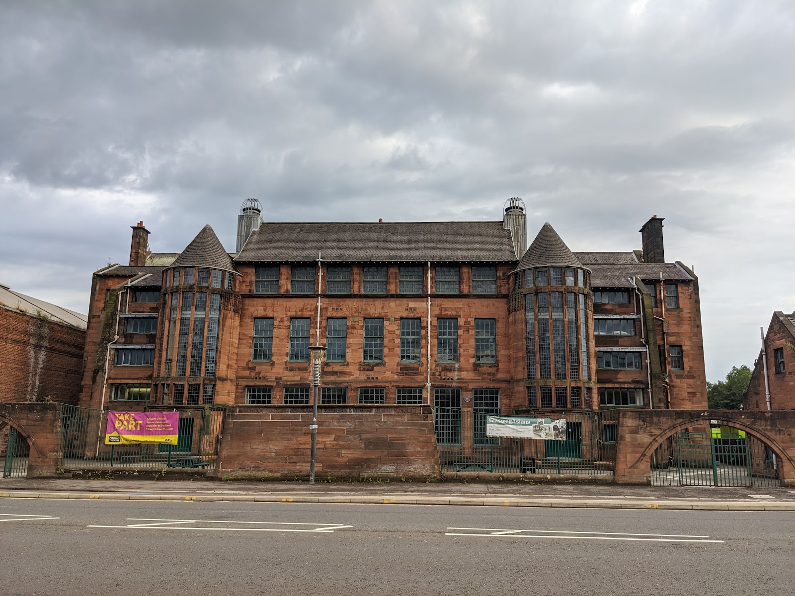 Scotland Street School across the road, its two glass stair towers either side of the red sandstone front.