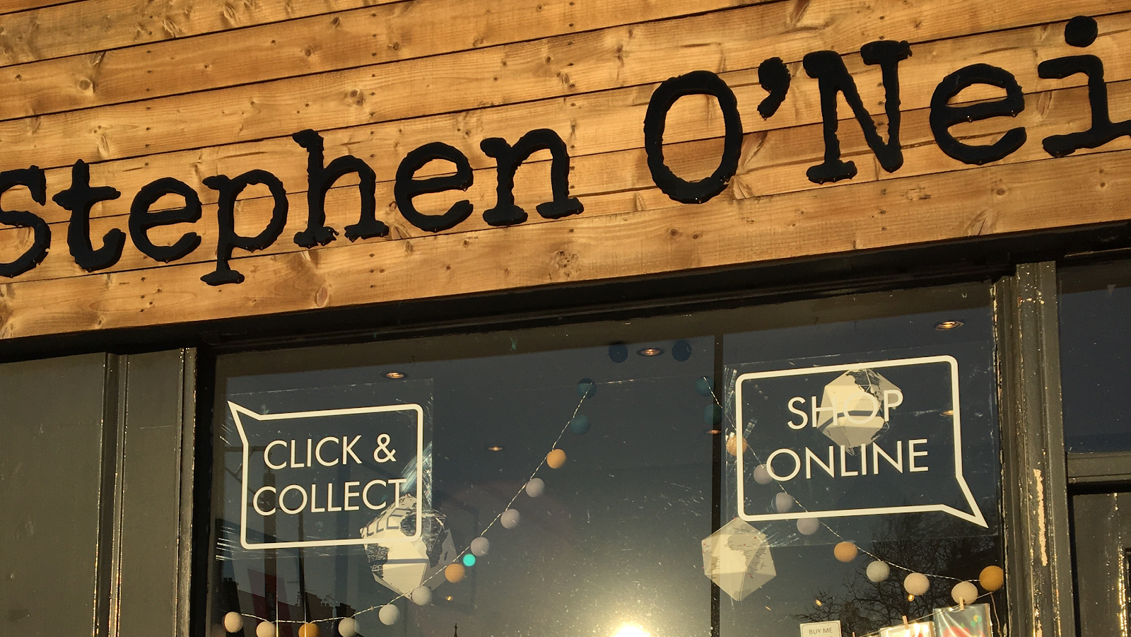 The carved wooden Stephen O'Neil sign over the window.