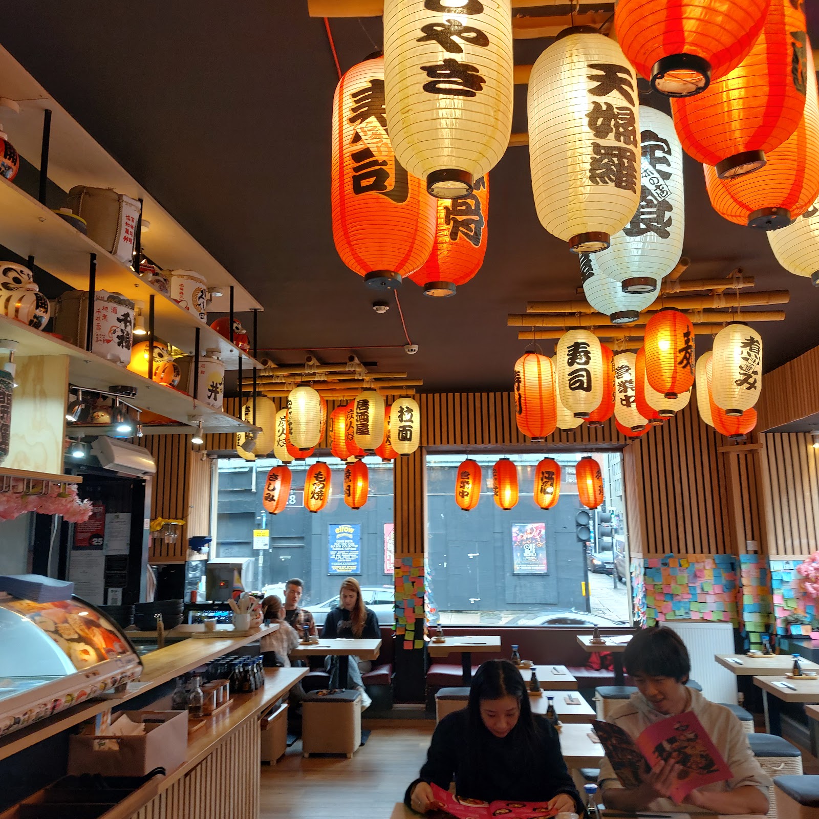 The dining room hung with red and white paper lanterns.