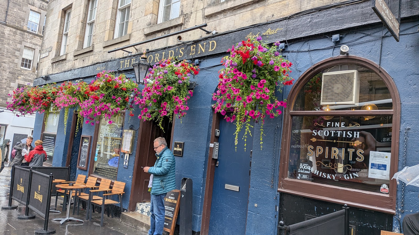 The World's End on the corner of the High Street, hung with flowers.