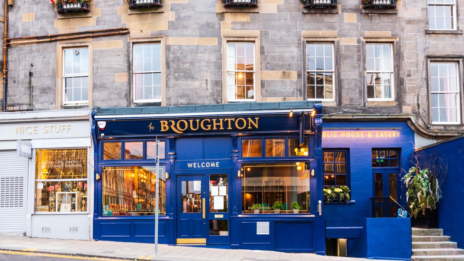 The Broughton's deep blue pub front on Broughton Street, its name in gold above the windows and Welcome over the door.