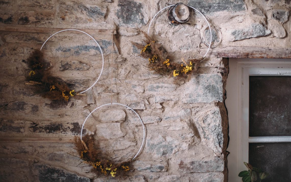 Stone wall with hanging keys and jewellery