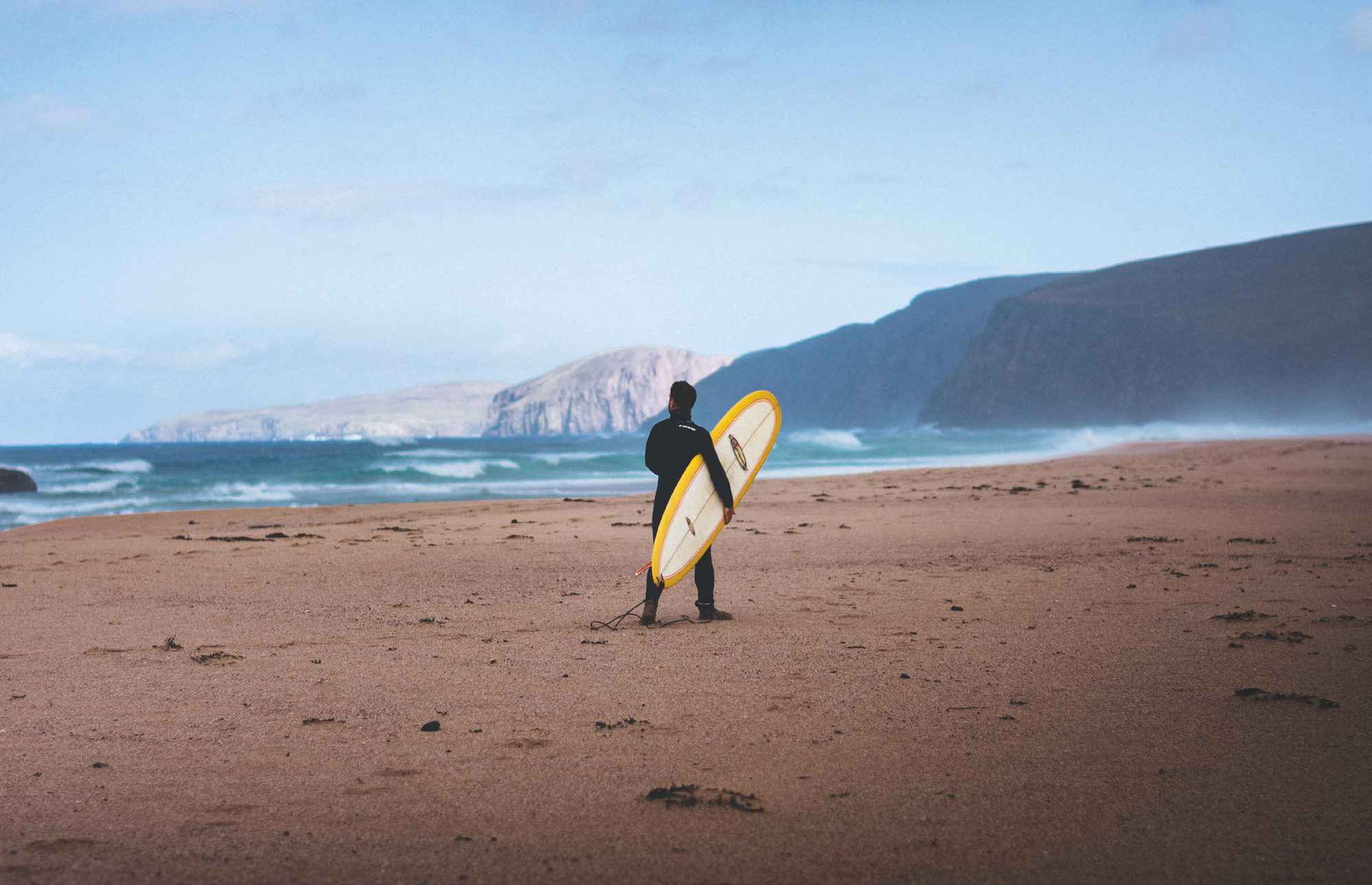 Surfer on the sands at Sandwood Bay