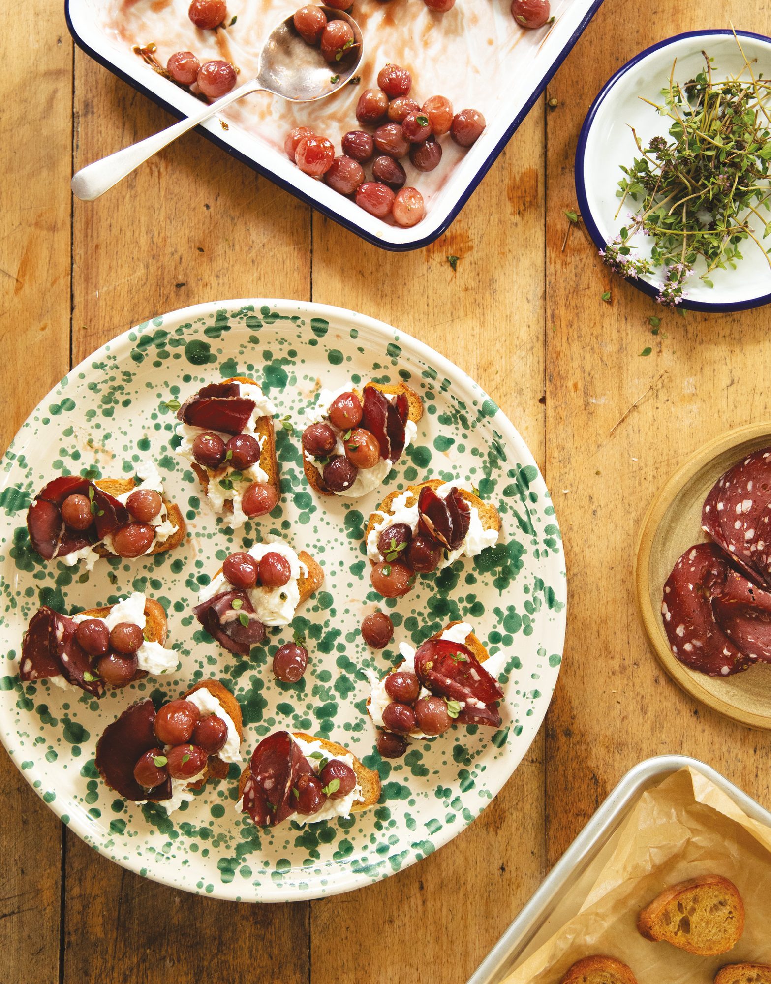 Roasted grapes, burrata and smoked venison crostini, flat lay