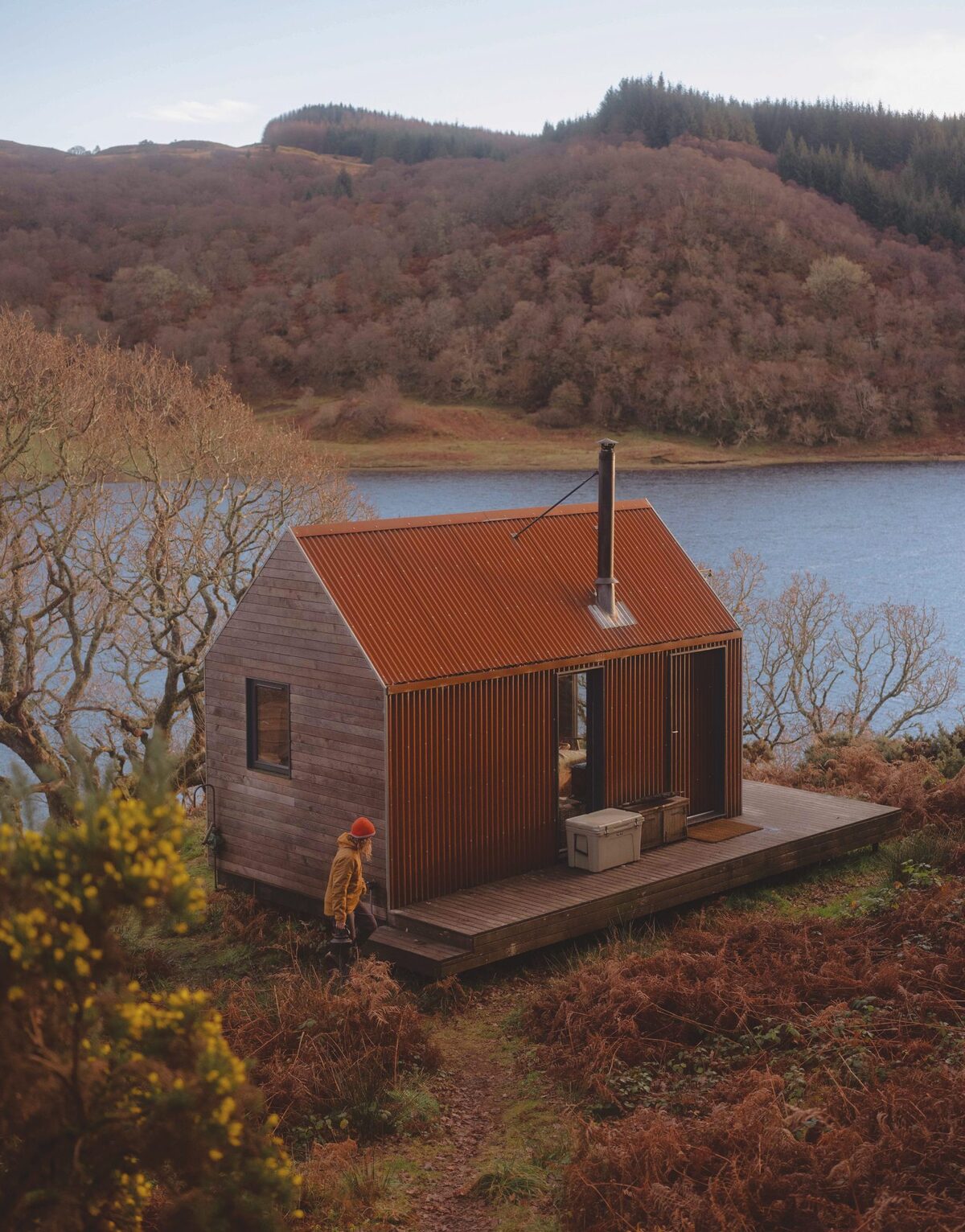 Inverlonan, red corrugated bothy above Loch Nell in autumn