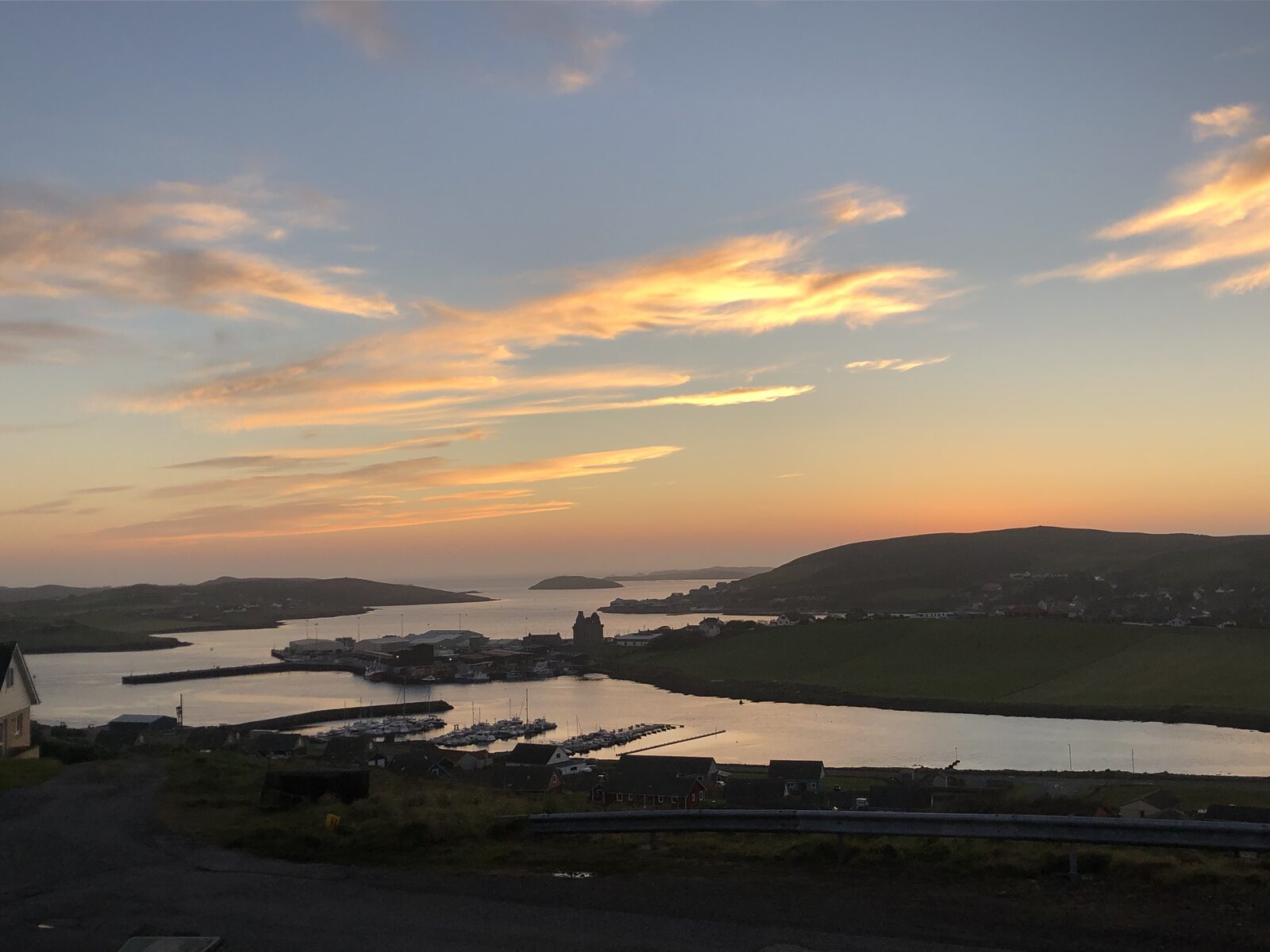 Scalloway, the castle in silhouette and Gallow Hill beyond