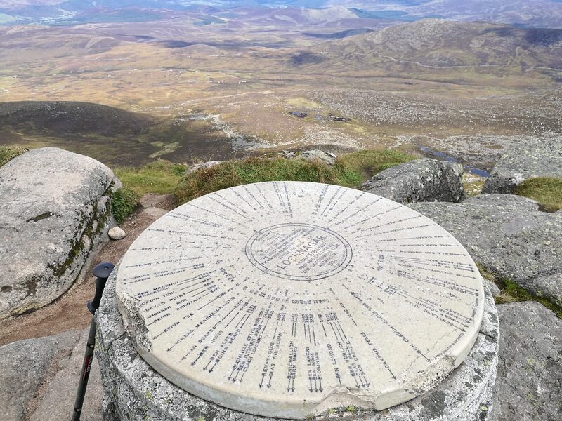The view indicator on the summit rocks with the moor far below.