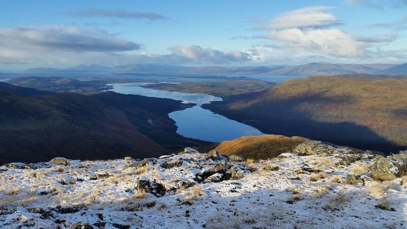 Looking down from the frosted hill to a long sea loch winding out towards the coast.