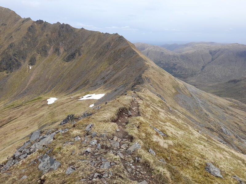 The pinnacled ridge of Mullach Fraoch-choire, steep grass falling away on both sides.