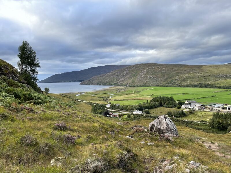 Little Loch Broom and the green fields and white houses at its head, from the rough hillside above.