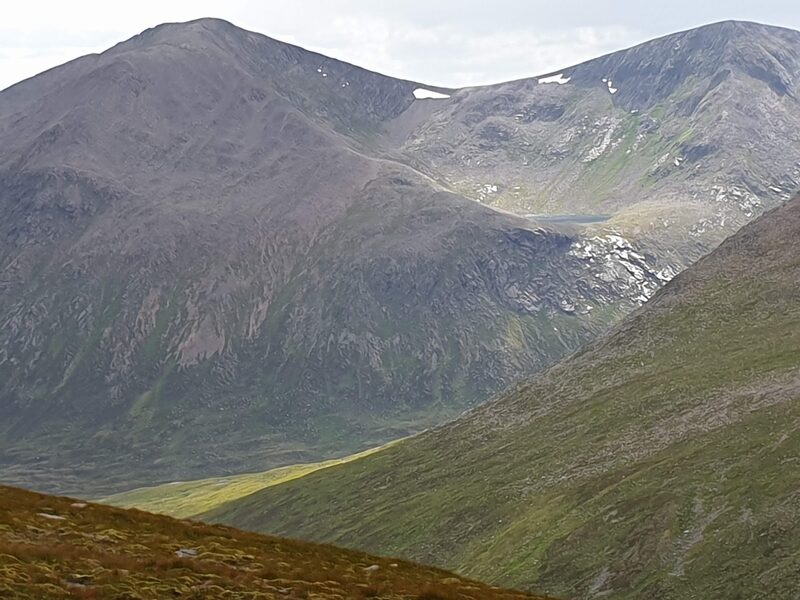 Sgòr an Lochain Uaine, on the right, and Cairn Toul across a deep glen, with the lochan in the corrie between them and late snow under the tops.