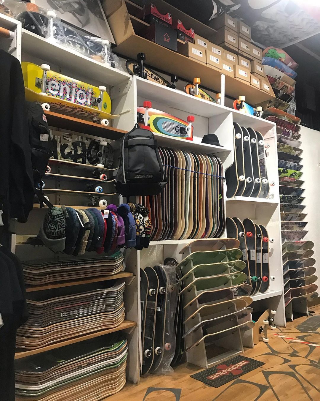 Skateboard decks lined up along the shop wall.