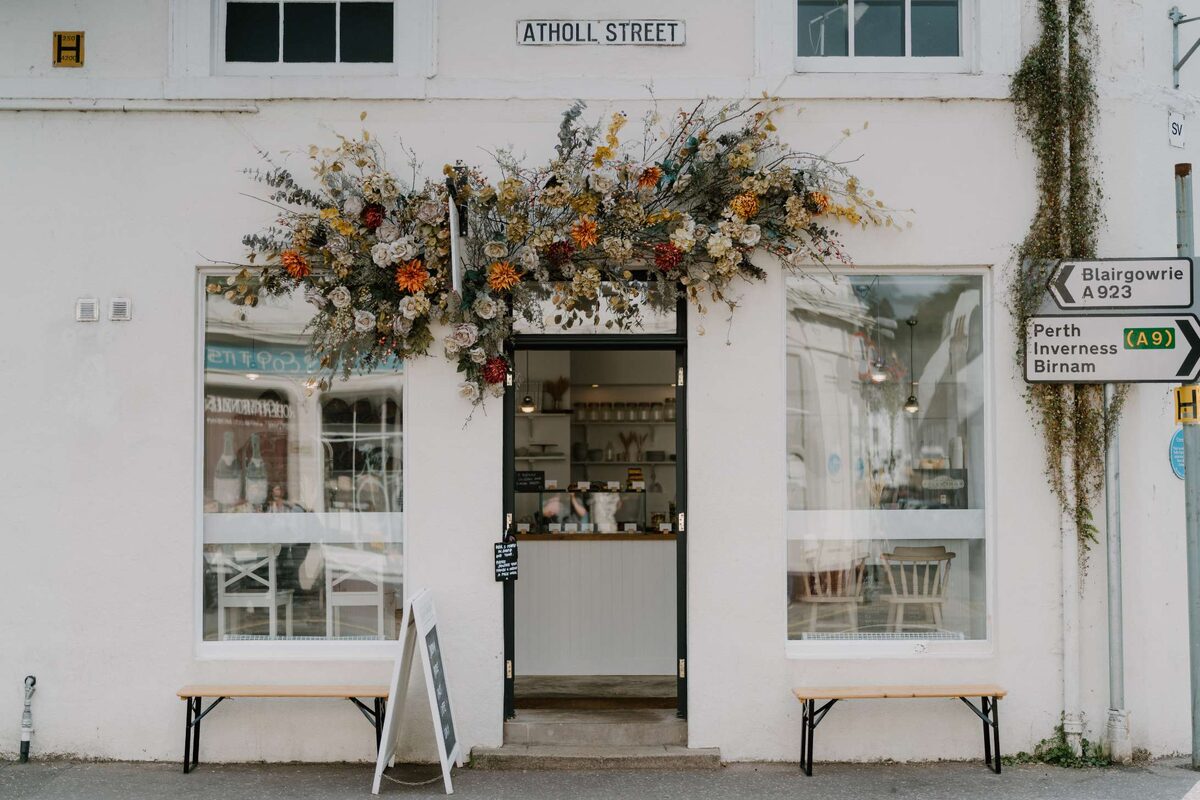 Dried flower display above a shopfront doorway on Atholl Street