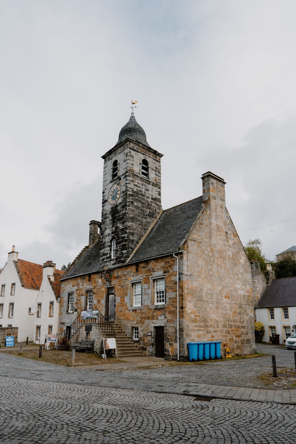 The Culross Town House, a grey stone tolbooth with a tower, facing the Forth.