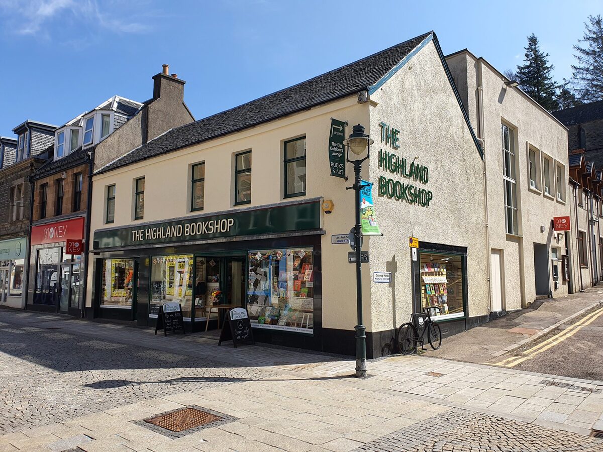 Corner building on a cobbled street housing The Highland Bookshop