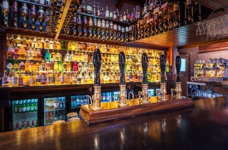 The back bar at Seumas' lined with whiskies.