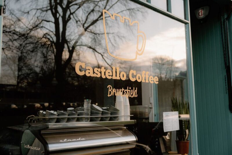 Castello Coffee Bruntsfield window lettering, espresso machine visible through the glass