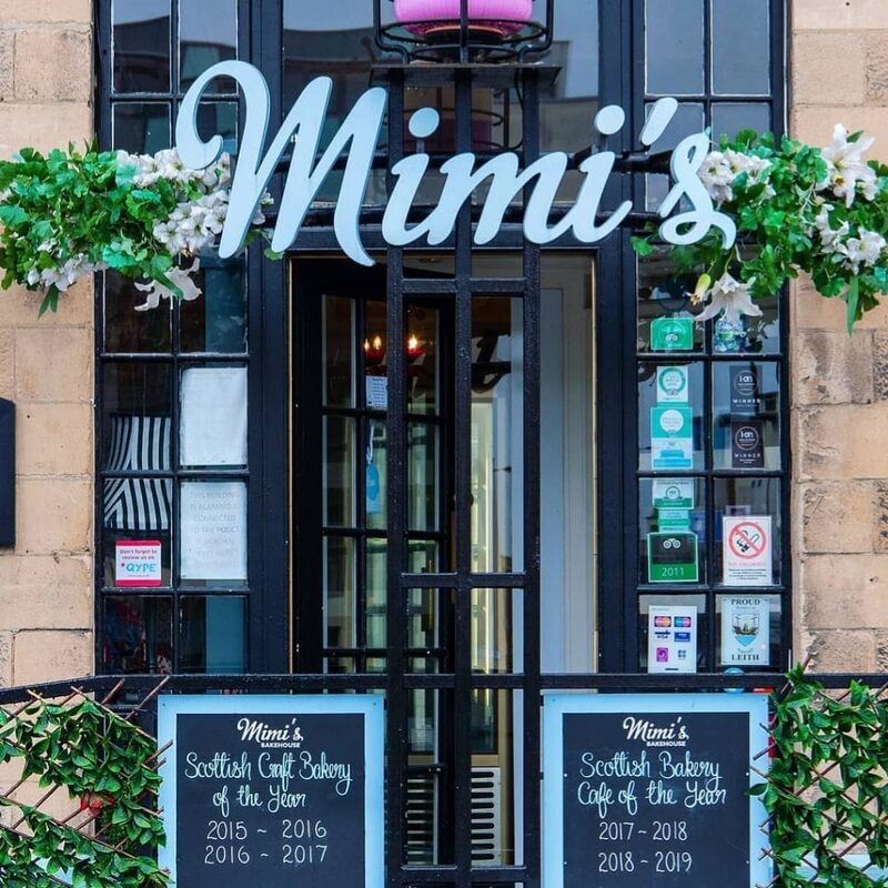 Mimi's shopfront with award chalkboards for Scottish Bakery and Café of the Year