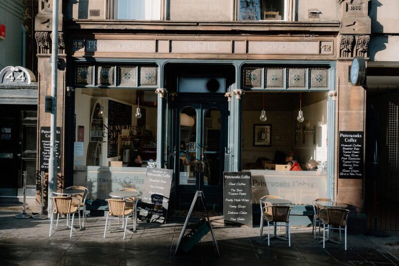 Petrucciolis Coffee shopfront with chalkboard menus and outdoor café tables